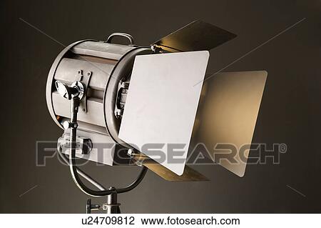 Stock Image - Studio light with opened barn doors.. Fotosearch