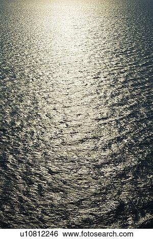 Sun reflecting on water. View Large Photo Image Stock Photograph - Sun reflecting on water.. Fotosearch