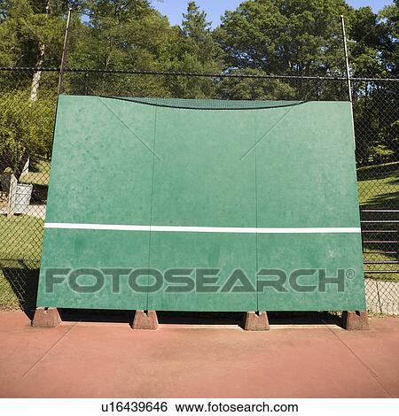 Stock Photograph - Tennis backboard for single practice in park.. Fotosearch