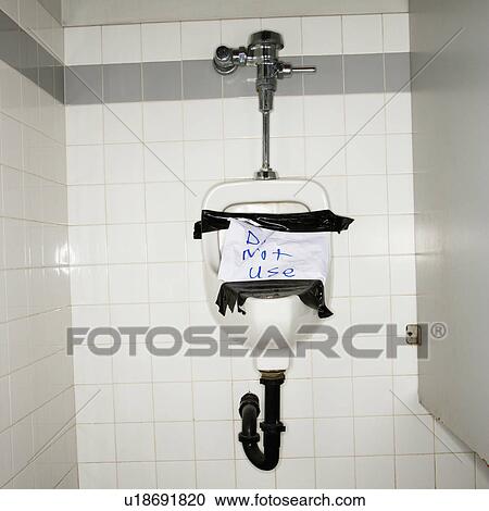 Urinal in men's bathroom with an out of order sign taped on it. View Large Photo Image Stock Image - Urinal in men's bathroom with an out of order sign taped on it.. Fotosearch