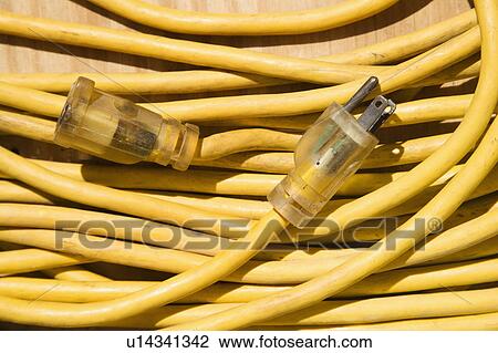 Stock Image - Yellow electric extension cord.. Fotosearch