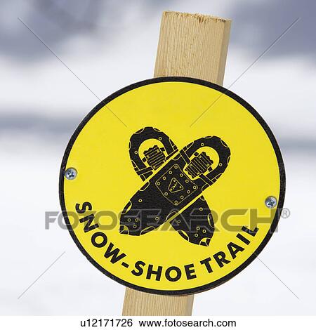 Stock Photograph - Yellow snowshoe trail sign.. Fotosearch