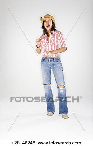 Young adult Caucasian woman wearing cowboy hat laughing. View Large Photo Image Stock Photo - Young adult Caucasian woman wearing cowboy hat laughing.. Fotosearch