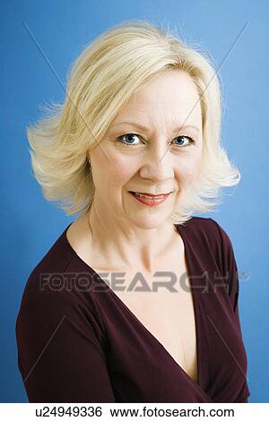 Stock Photograph - Close up studio portrait of attractive adult businesswoman looking at viewer.. Fotosearch