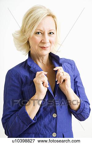 Stock Photo - Studio portrait of attractive adult woman looking at viewer.. Fotosearch