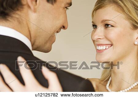 A bride hugs her husband smiling View Large Photo Image Stock Image - A bride hugs her husband smiling. Fotosearch
