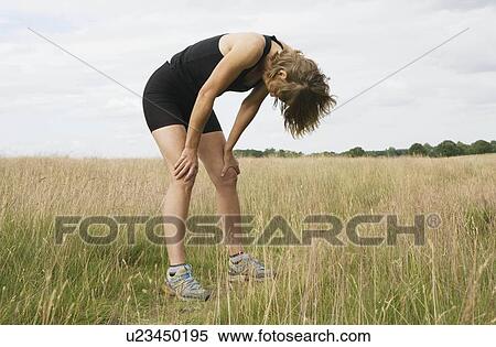 Exhausted woman runner resting View Large Photo Image Stock Photography - Exhausted woman runner resting. Fotosearch