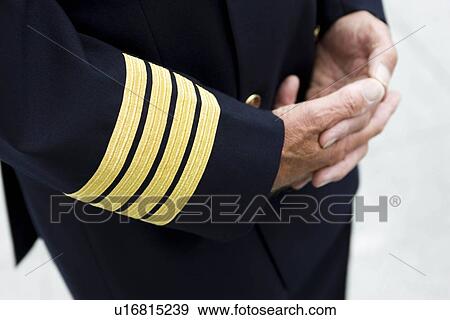 Stock Photo - Flight captains hands folded. Fotosearch