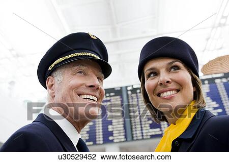 Stock Image - Flight personnel smiling. Fotosearch