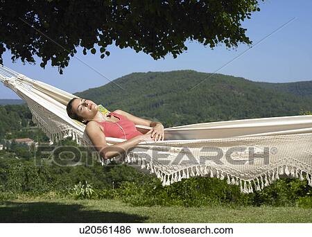 Girl asleep in hammock View Large Photo Image Stock Photograph - Girl asleep in hammock. Fotosearch