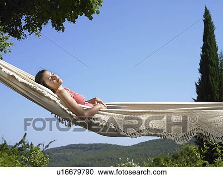 Girl resting in hammock View Large Photo Image Stock Image - Girl resting in hammock. Fotosearch
