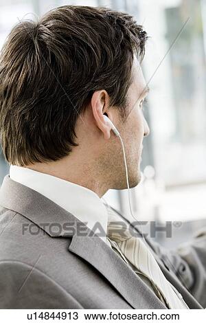 Stock Image - Man wearing headphones. Fotosearch