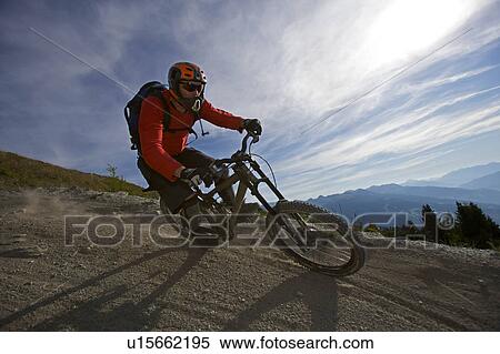 Mountain biker riding fast View Large Photo Image Stock Photography - Mountain biker riding fast. Fotosearch