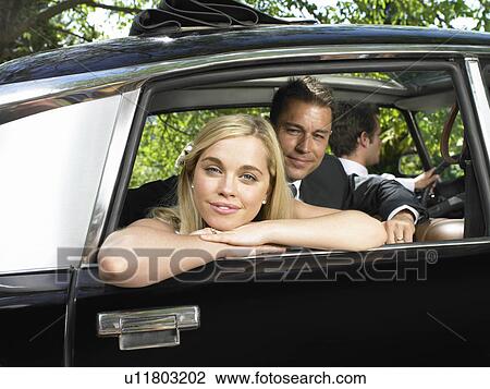 Portrait of bride and groom in car View Large Photo Image Stock Image - Portrait of bride and groom in car. Fotosearch