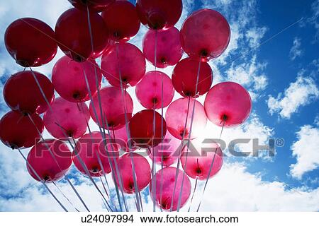 Red balloons against blue sky View Large Photo Image Picture - Red balloons against blue sky. Fotosearch