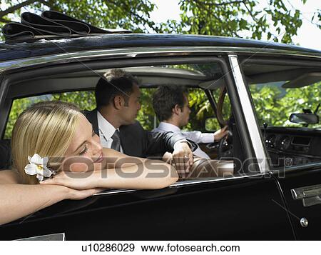 Stock Photo - Wedding couple in car. Fotosearch