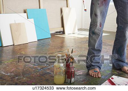 Artist standing by paint brushes and paint thinner in studio low section View Large Photo Image Stock Image - Artist standing by paint brushes and paint thinner in studio low section. Fotosearch