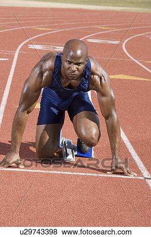 Athlete ready to run View Large Photo Image Stock Photo - Athlete ready to run. Fotosearch