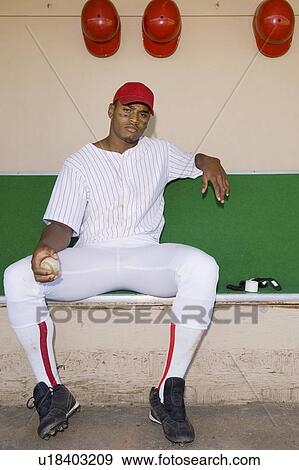 Baseball pitcher sitting in dugout (portrait) View Large Photo Image Stock Photo - Baseball pitcher sitting in dugout (portrait). Fotosearch