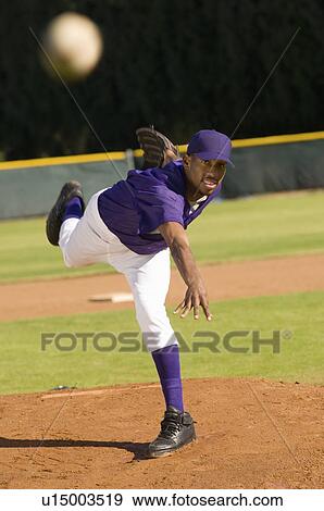 Baseball pitcher throwing ball View Large Photo Image Stock Photo - Baseball pitcher throwing ball. Fotosearch