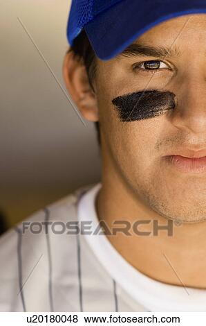 Stock Photo - Baseball player with eye black (close-up). Fotosearch