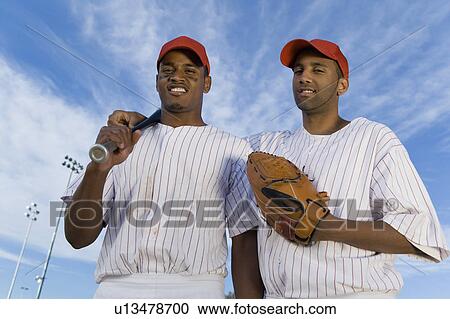 Baseball team mates outdoors (portrait) View Large Photo Image Stock Image - Baseball team mates outdoors (portrait). Fotosearch