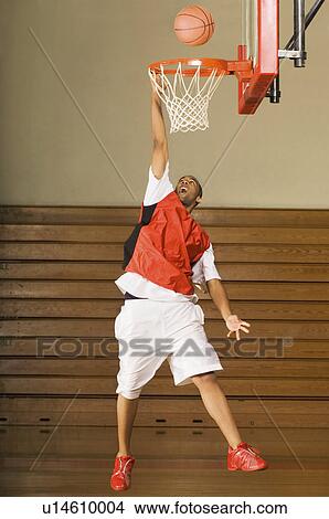 Picture - Basketball player missing slam dunk. Fotosearch