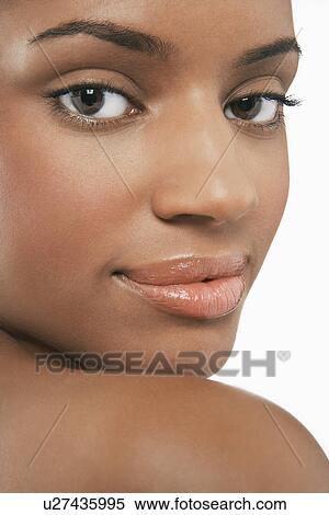 Beautiful Young looking over shoulder View Large Photo Image Stock Photography - Beautiful Young looking over shoulder. Fotosearch