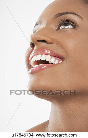Picture - Beautiful Young Woman with open mouth looking up. Fotosearch