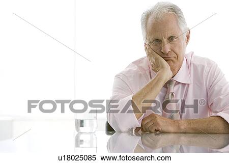 Stock Photography - Bored business man in conference room. Fotosearch