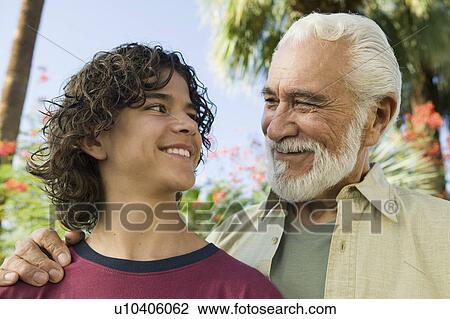 Boy (13-15) with Grandfather outdoors front view. View Large Photo Image Stock Image - Boy (13-15) with Grandfather outdoors front view.. Fotosearch