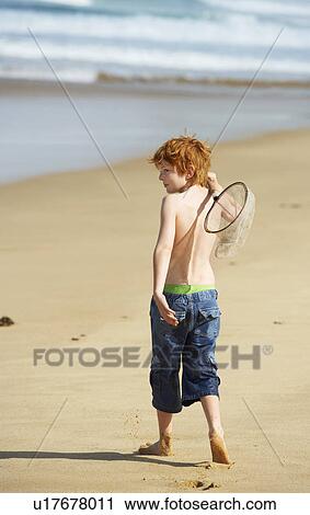 Boy Playing on Beach View Large Photo Image Stock Image - Boy Playing on Beach. Fotosearch