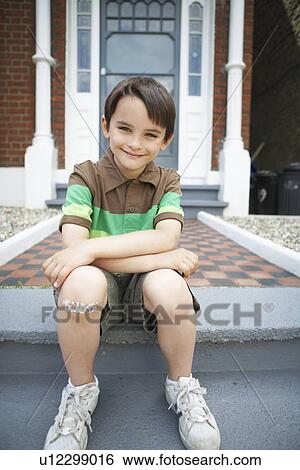 Stock Photograph - Boy With Bandaid on Knee. Fotosearch