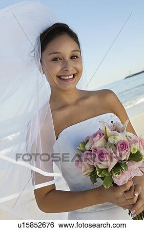Bride with bouquet on Beach (portrait) View Large Photo Image Stock Photograph - Bride with bouquet on Beach (portrait). Fotosearch