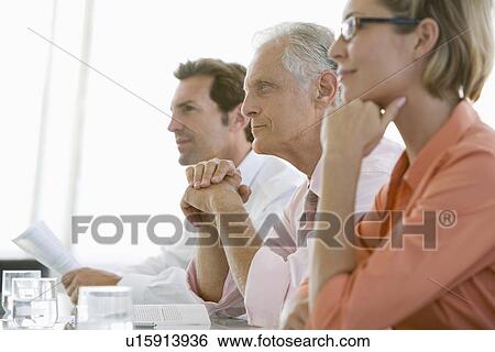 Stock Photograph - Business colleagues in conference meeting. Fotosearch