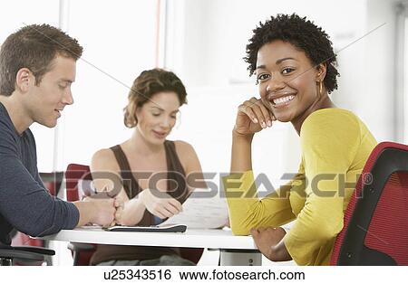 Business colleagues in office meeting portrait View Large Photo Image Stock Photograph - Business colleagues in office meeting portrait. Fotosearch