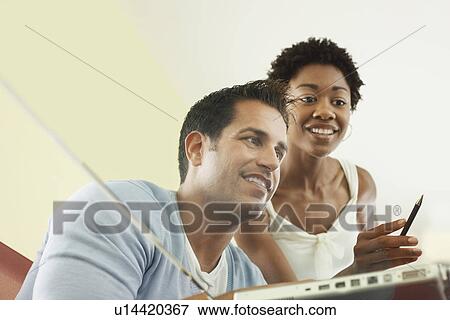 Business colleagues working in office low angle view View Large Photo Image Stock Photo - Business colleagues working in office low angle view. Fotosearch