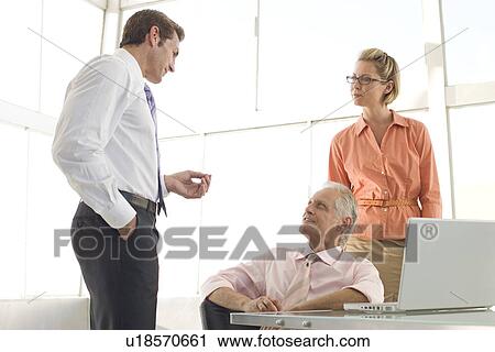 Business colleagues working in conference room View Large Photo Image Stock Image - Business colleagues working in conference room. Fotosearch