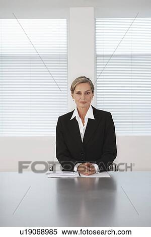 Business Executive Sitting in Boardroom View Large Photo Image Stock Photography - Business Executive Sitting in Boardroom. Fotosearch
