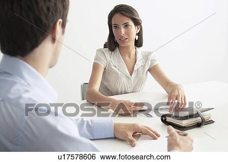 Business man and woman in meeting View Large Photo Image Stock Photograph - Business man and woman in meeting. Fotosearch