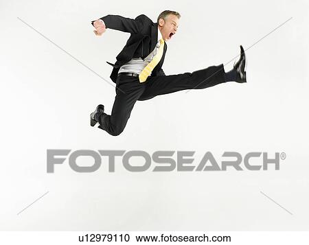 Business man jumping full length View Large Photo Image Stock Image - Business man jumping full length. Fotosearch