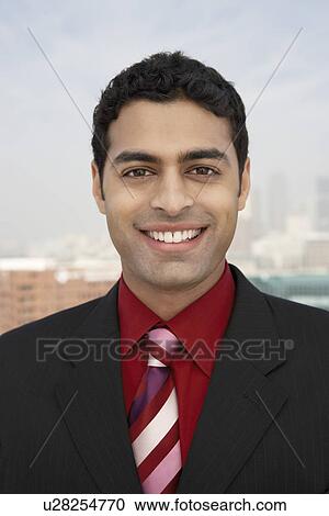 Business man smiling outdoors View Large Photo Image Stock Image - Business man smiling outdoors. Fotosearch