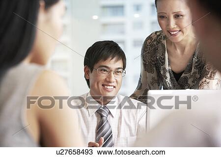 Business people at meeting in office View Large Photo Image Stock Image - Business people at meeting in office. Fotosearch