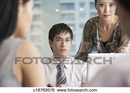 Business people sitting in office View Large Photo Image Stock Photograph - Business people sitting in office. Fotosearch