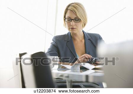 Business woman working in conference room View Large Photo Image Picture - Business woman working in conference room. Fotosearch