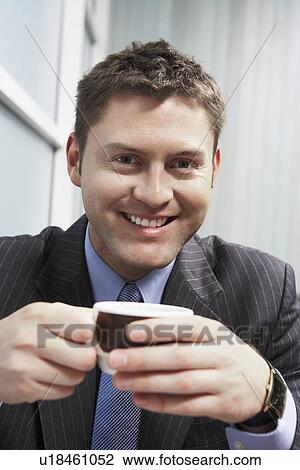 Businessman Holding Coffee Cup portrait head and shoulders View Large Photo Image Stock Image - Businessman Holding Coffee Cup portrait head and shoulders. Fotosearch
