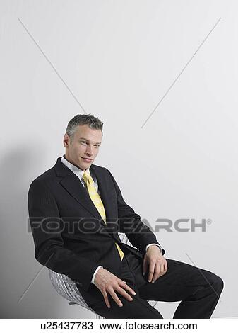 Businessman Sitting in Swivel Chair View Large Photo Image Stock Image - Businessman Sitting in Swivel Chair. Fotosearch