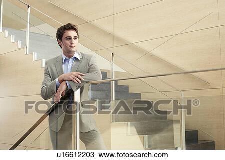 Businessman Standing on Stairs View Large Photo Image Stock Image - Businessman Standing on Stairs. Fotosearch