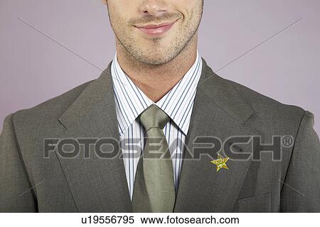 Businessman with gold star on suit portrait View Large Photo Image Stock Photography - Businessman with gold star on suit portrait. Fotosearch