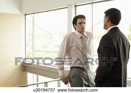Stock Photo - Businessmen in Conversation. Fotosearch